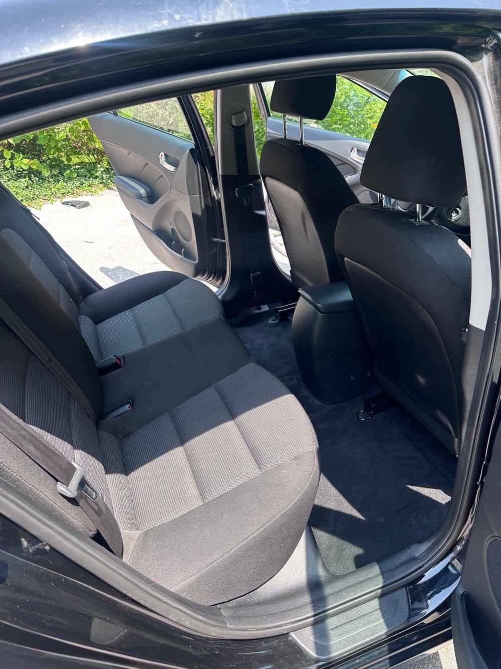 Same back seat spotless after interior shampoo and vacuum