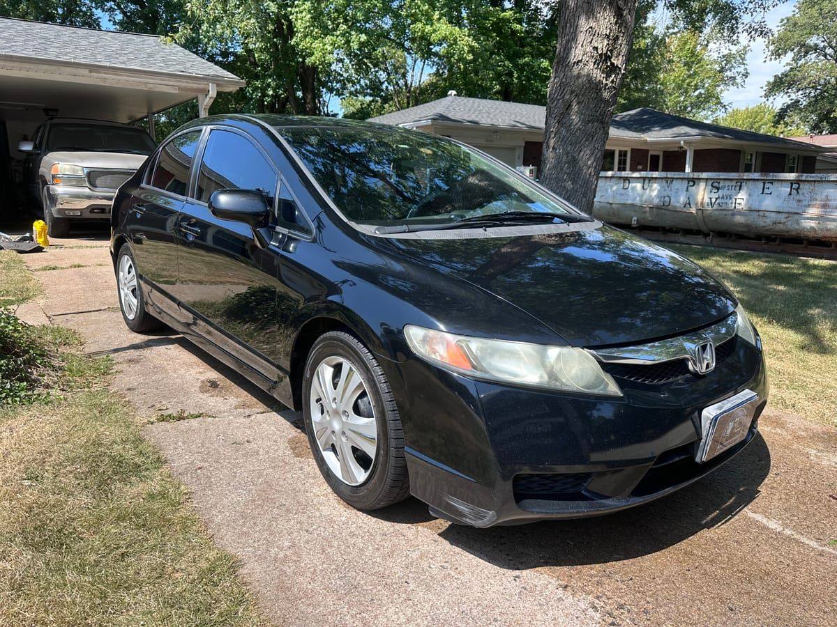 Same black Honda Civic with deep glossy paint after a full detail in Belleville, IL