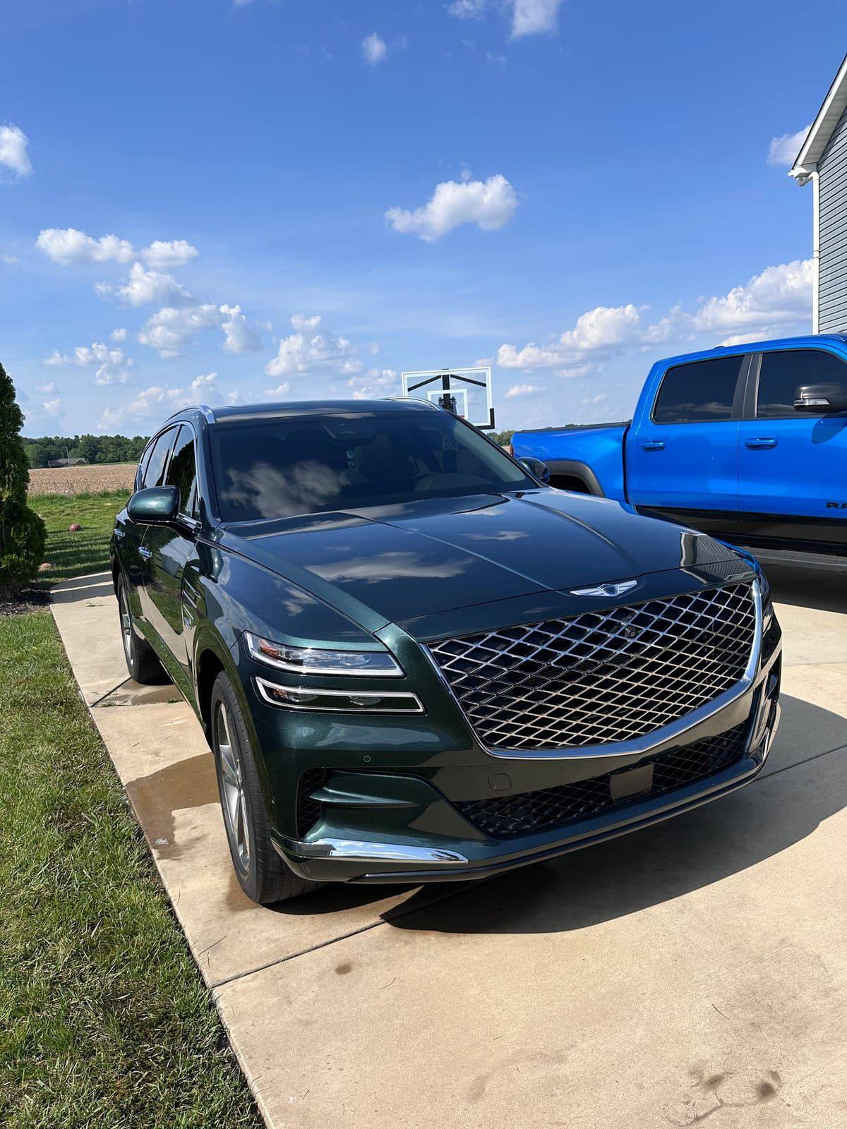 Dark green Genesis GV80 with high gloss paint finish after detailing