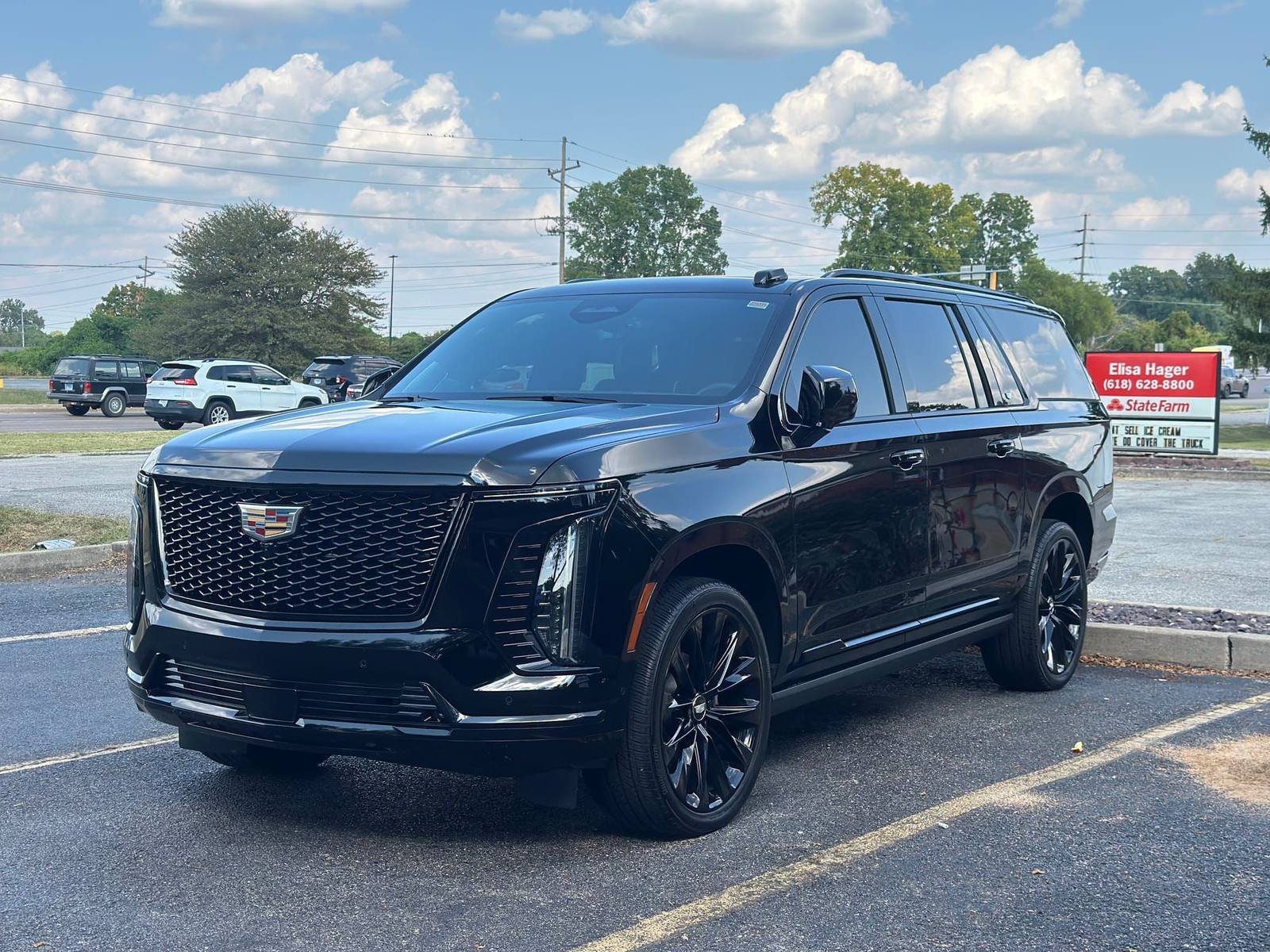 Black Cadillac Escalade with mirror-deep gloss after paint enhancement and detailing in Belleville, IL