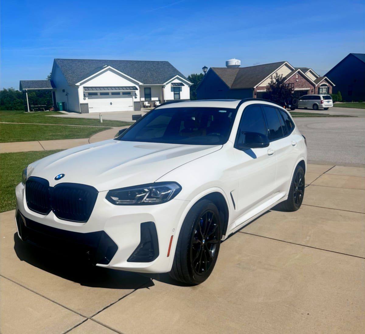 White BMW X3 M with clean glossy paint detailed at a Metro East home